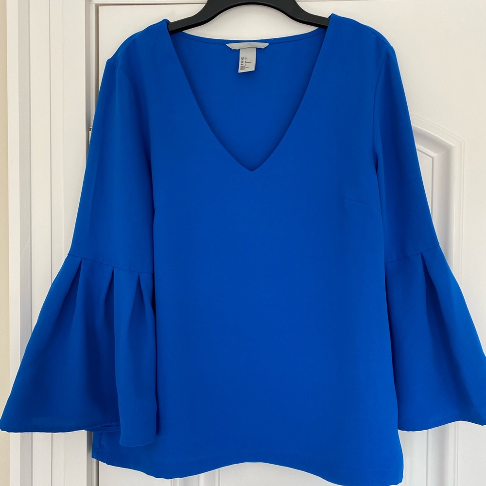 Beautiful royal blue, v-neck blouse with flouncy 3/4 sleeves!